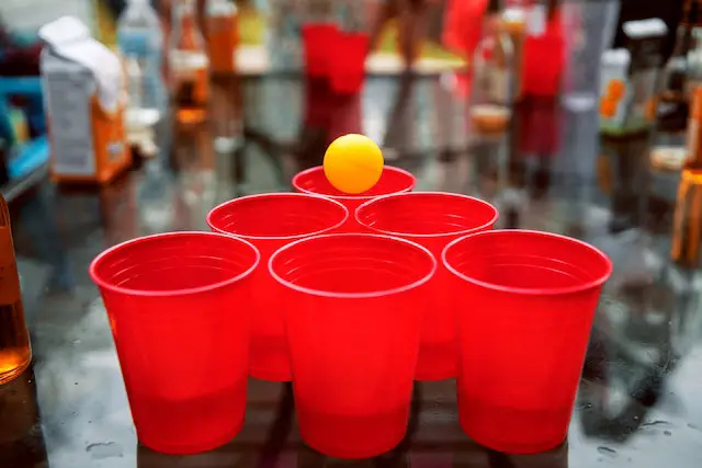 Picture of a group of people playing beer pong
