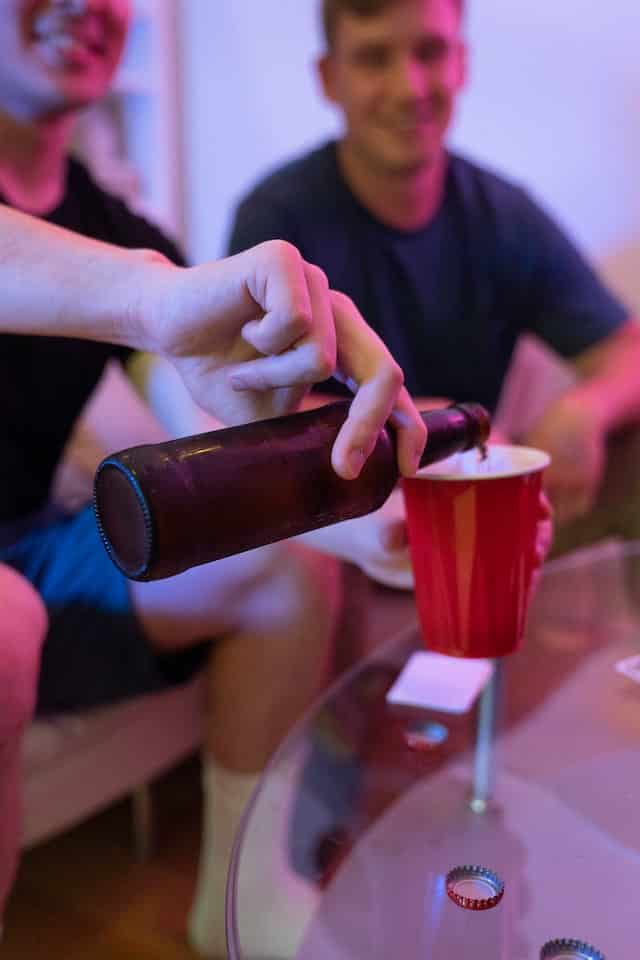 Pouring beer in a red cup